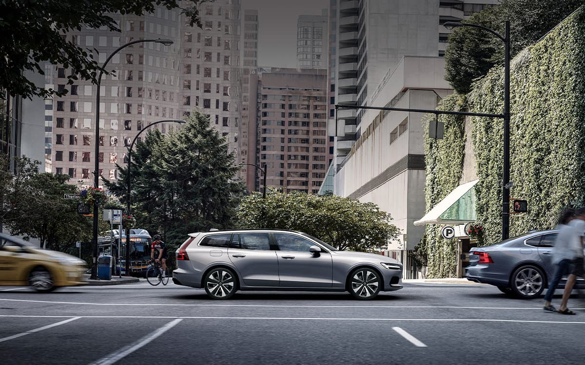 Volvo estate car V60 drives through city